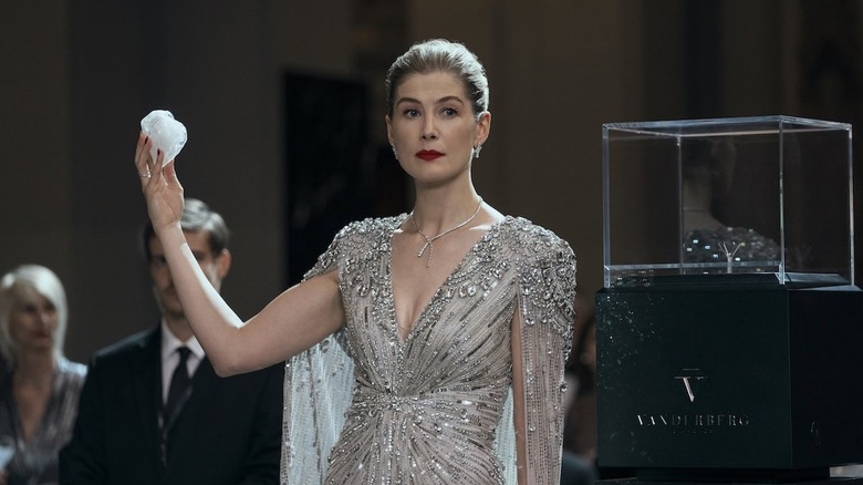 Veronika holding up the Heart Diamond in a bejeweled dress in Now You See Me: Now You Don't