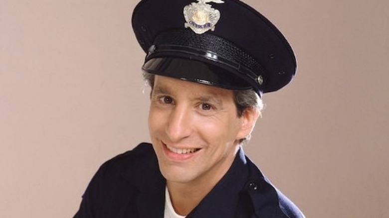 Charles Levin smiling in police officer uniform