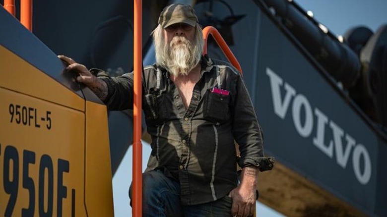 Tony Beets standing by machinery