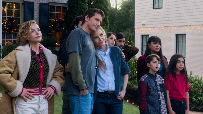 The Clauster family standing together outside