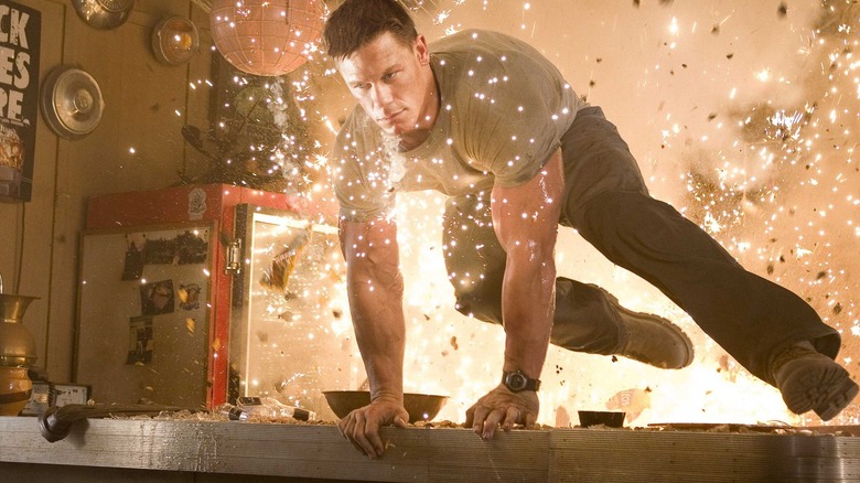 John Triton lunging away from an explosion