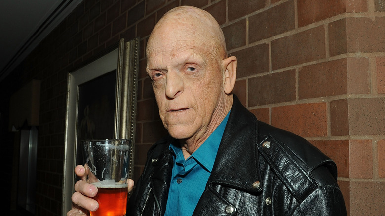 Michael holding a beer