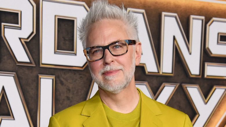James Gunn smiling yellow suit