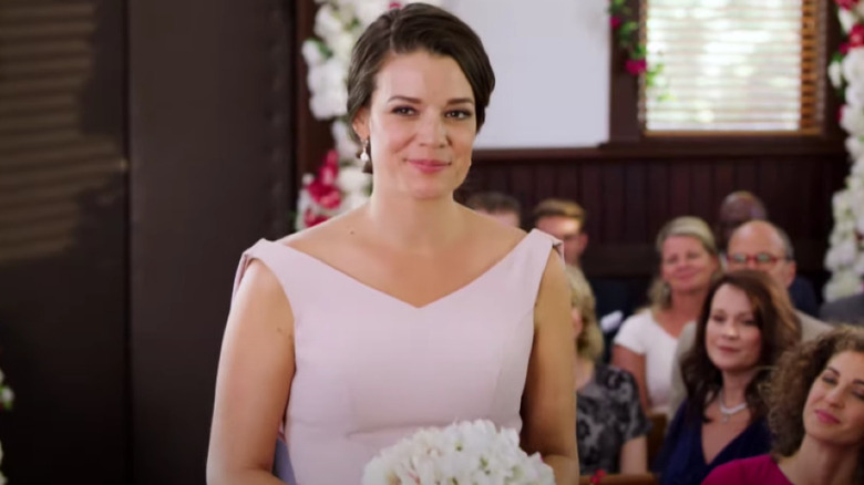 Brooke smiling in bridesmaid dress