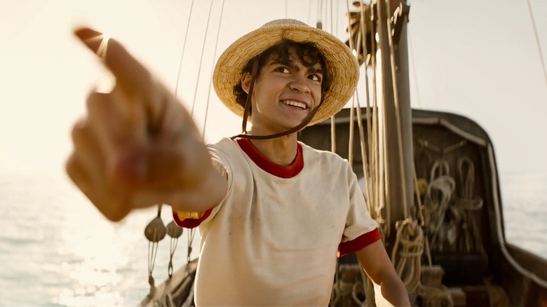 Monkey D. Luffy points on a small ship