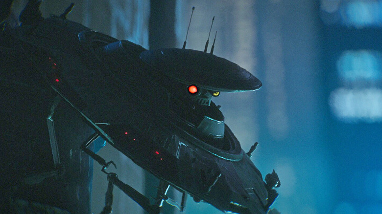 Spybot perched at an angle and flashing a mechanical scowl in "Star Wars: Maul — Shadow Lord" (2026)
