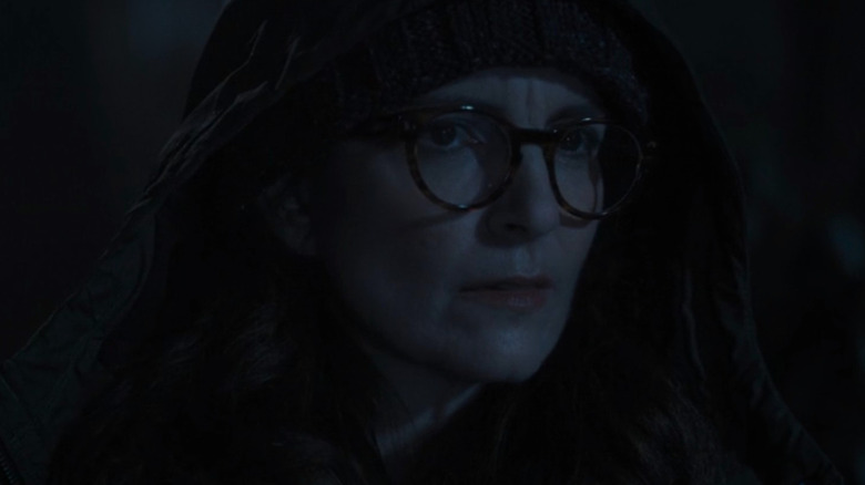 Cinda Canning walking through woods