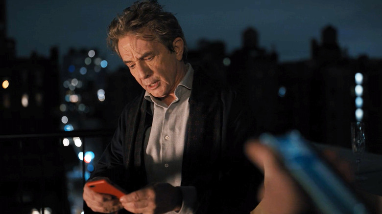 Martin Short looking at phone
