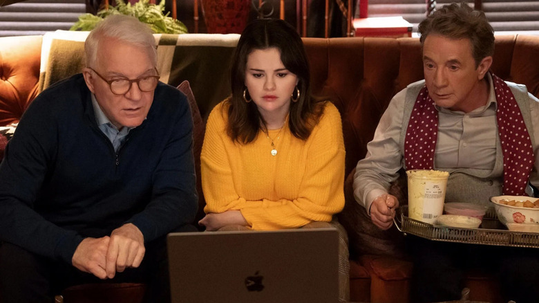 Charles, Mabel and Oliver looking at a laptop in Only Murders in the Building