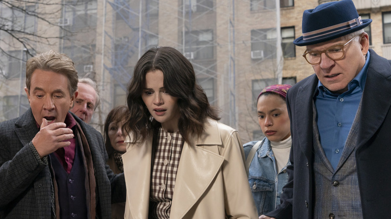 Charles, Oliver and Mabel look down in horror in "Only Murders in the Building" (2025)