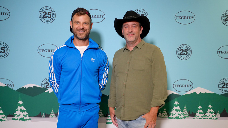 Matt Stone and Trey Parker smiling together on red carpet
