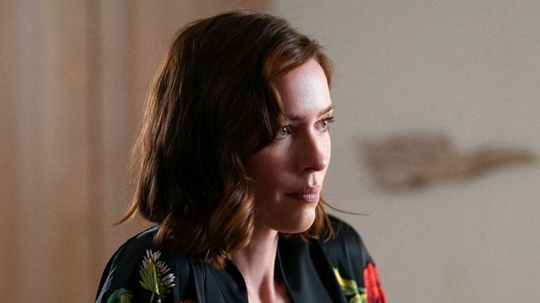 Hanna Kammler smirking in in "Onslaught" (2026)