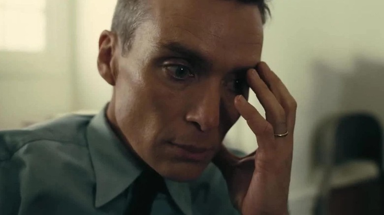 J. Robert Oppenheimer with hand on face