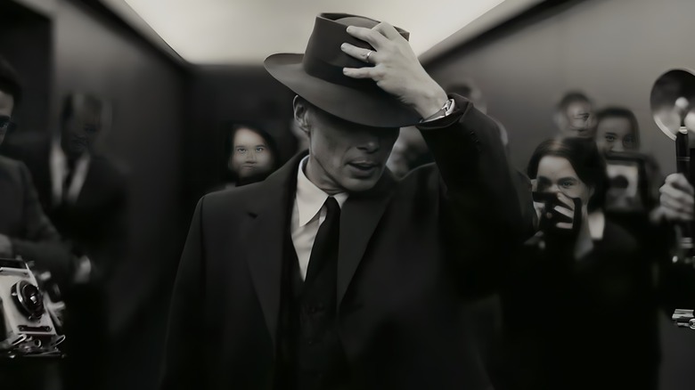 Oppenheimer hand on hat