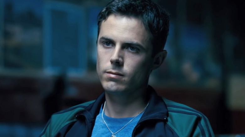 Casey Affleck wears a necklace