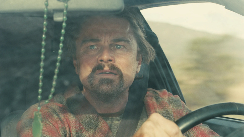 Bob frantically driving the car in One Battle After Another