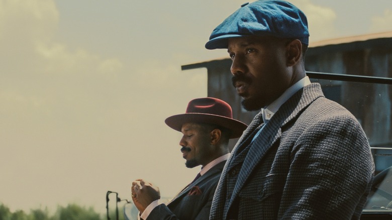 Stack rolling a cigarette and Smoke leaning against the car in Sinners