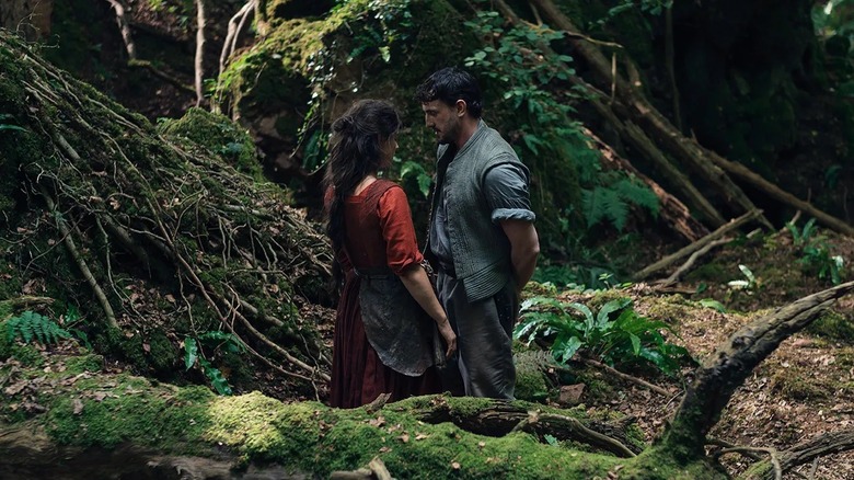 Agnes and William Shakespeare talking in the woods in Hamnet (2025)