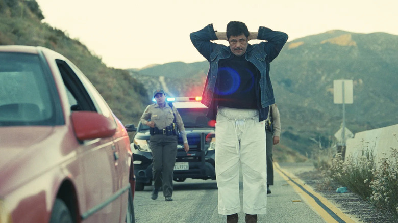 Sensei Sergio with his hands behind his head in One Battle After Another