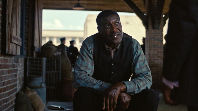 Delta Slim at the train station looking suspicious in Sinners