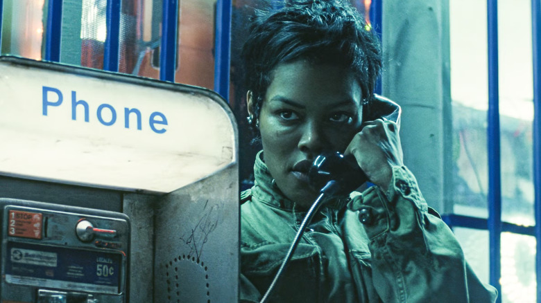 Perfidia using a payphone in One Battle After Another