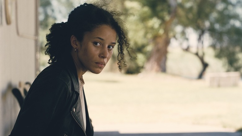 Willa Ferguson trapped on a bench in One Battle After Another (2026)