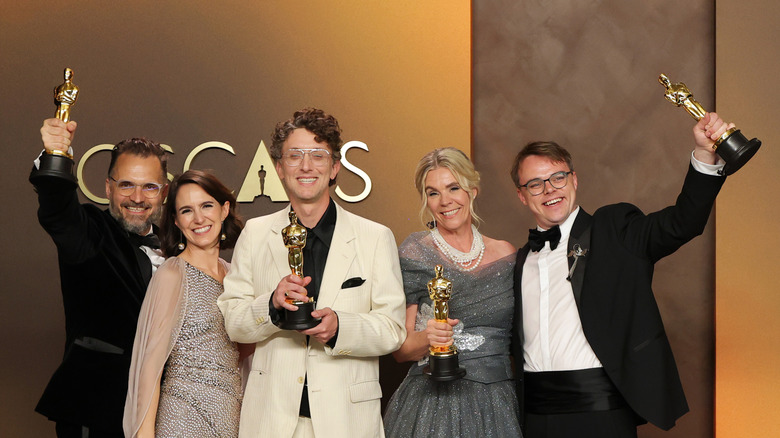 The Mr. Nobody Against Putin team clutching their Oscars (2026)