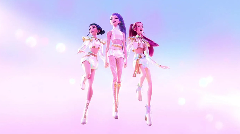 Huntrix floating in the air while performing