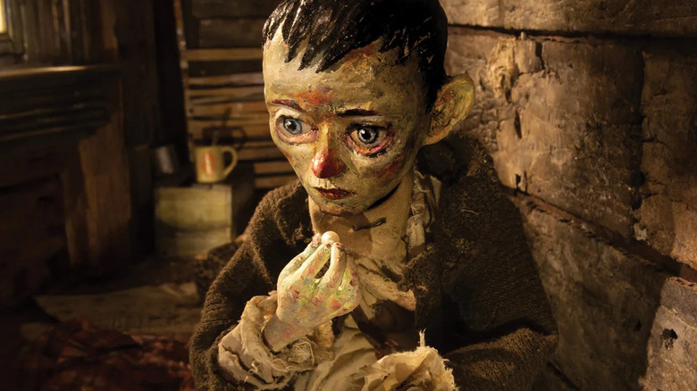 A girl holding a pearl in The Girl Who Cried Pearls