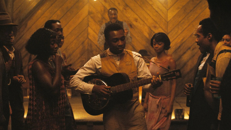 Sammie playing his song in Sinners