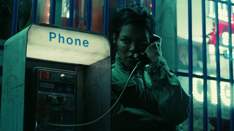 Perfidia using the payphone outside