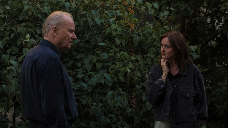 Gustav and Nora Borg standing outside facing each other