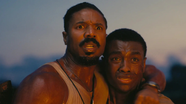 Smoke hugging Sammy in the lake in Sinners