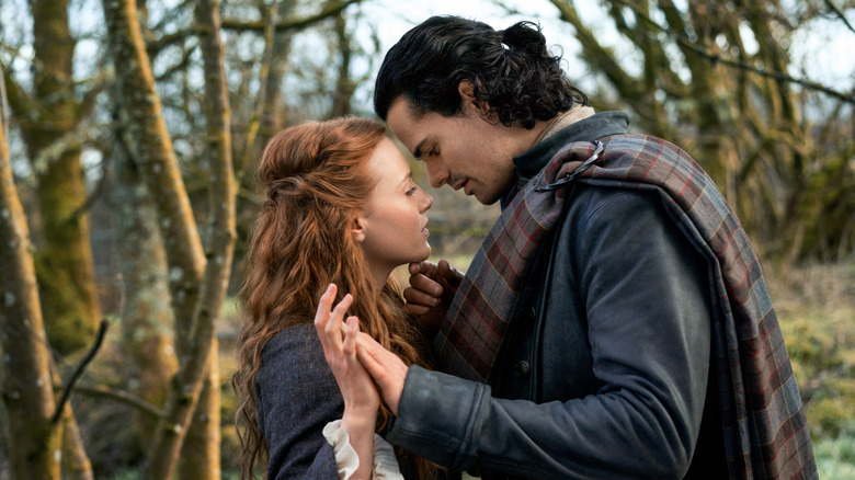 Brian and Ellen embracing in forest
