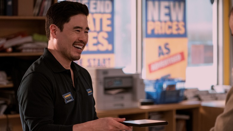 Timmy laughing holding DVD