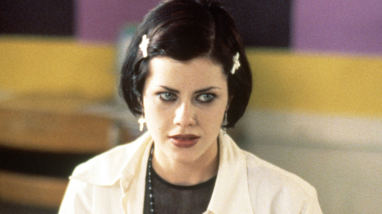 Nancy sitting at her desk in The Craft