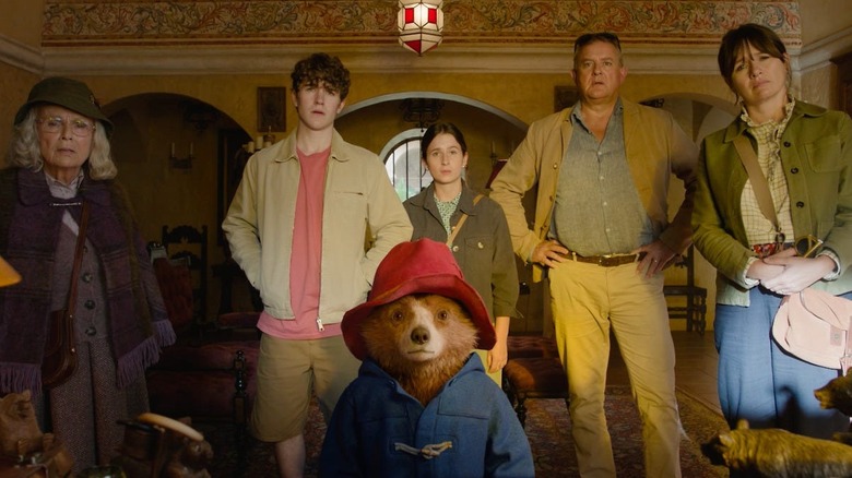 Mrs. Bird Jonathan Judy Henry and Mary looking confused behind a shocked Paddington in Paddington in Peru