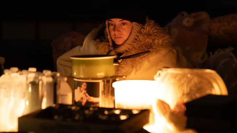 Annie covered in blankets in the dark in Paradise Season 2