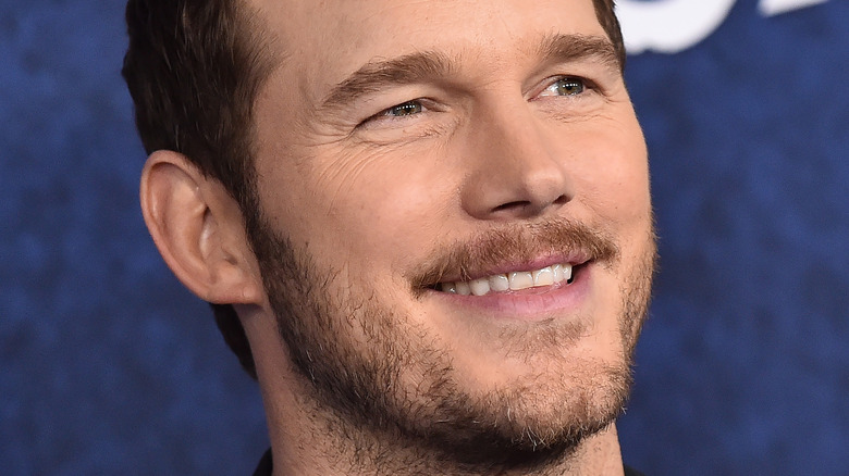 Chris Pratt smiling with stubble