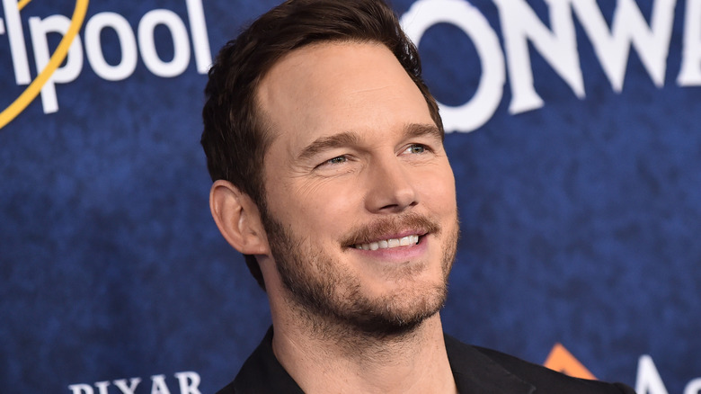Chris Pratt smiling with stubble