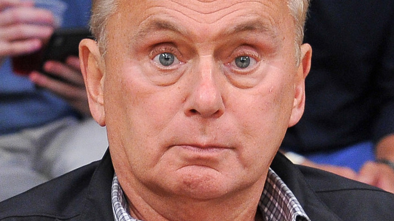 Pat Sajak staring ahead