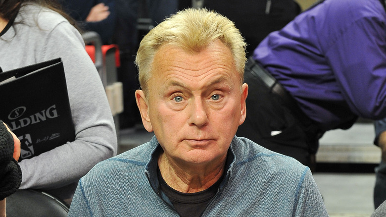 Pat Sajak sitting