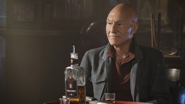Jean-Lic Picard wearing a black jacket and burgundy shirt