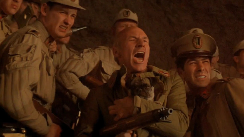 Gurney Halleck holding a pug and leading the charge in "Dune" (1984)