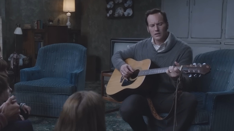 Ed Warren playing guitar