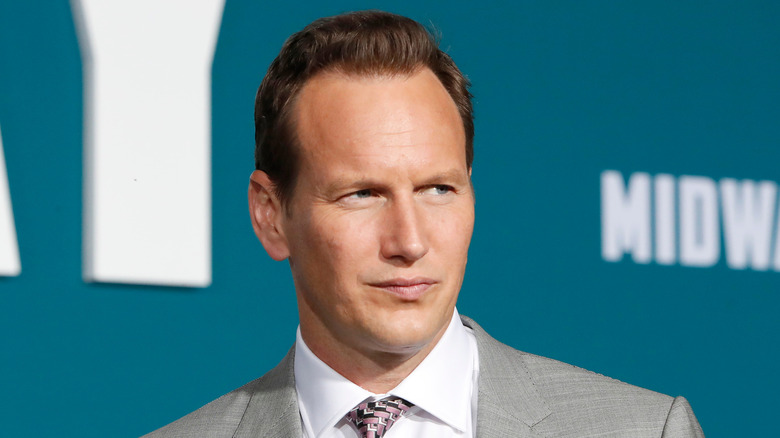 Patrick Wilson smiling in grey suit