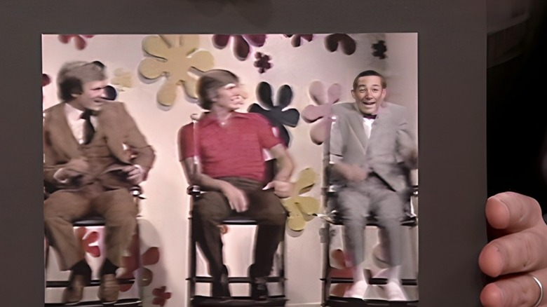 Jimmy Fallon holding a still of Paul Reubens on The Dating Game