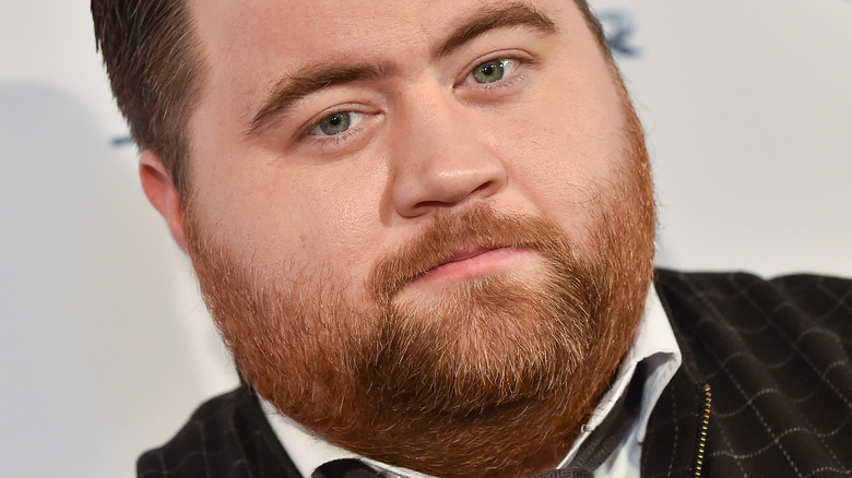 Paul Walter Hauser looking