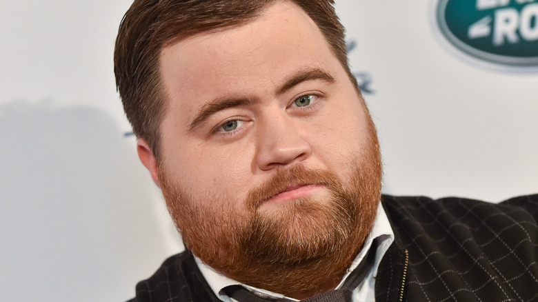 Paul Walter Hauser looking