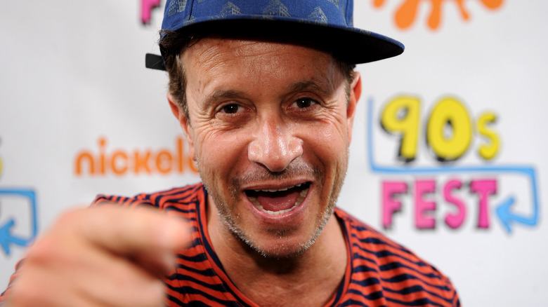 Pauly Shore smiling in baseball hat